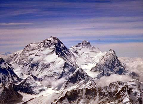 Mount Everest viewed from the summit of Cho Oyu. The Northeast ridge runs along the left skyline with the North Ridge dropping off toward the North Col and Changtse about half way down. The Western Cwm, South Col, and Southeast ridge are visible to the right, as well as Lhotse and Nuptse. (IMG Stock Photo taken by Craig John) 