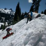 Lowering a rescue sled in steep terrain