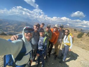 Huayhuash trekkers on the way to Laguna Wilcacocha with the high peaks in the background (Tyler Nachand)