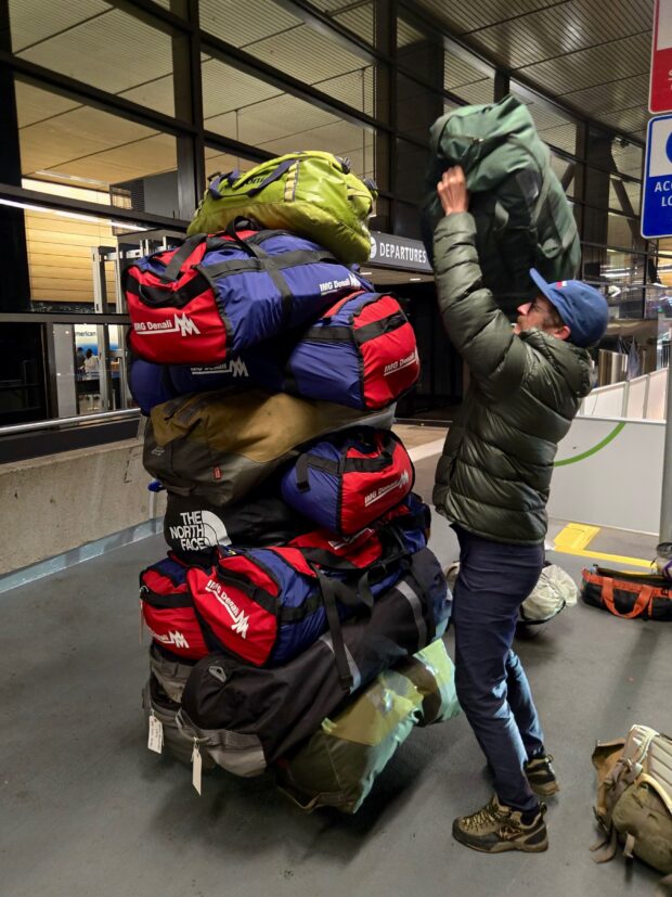 A tower of duffel bags ready to head to Talkeetna