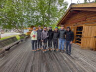 An IMG Denali team takes a group photo in Talkeetna