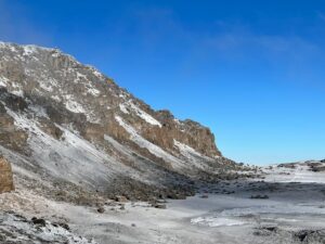 Looking across the crater from Stella Point with Uhuru Peak up above (Max Bond)