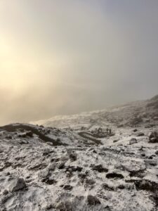 Looking down the trail from near Stella Point at sunrise with another team coming up (Max Bond)