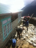 Rebuilding damaged wall in Phortse (Phunuru Sherpa)