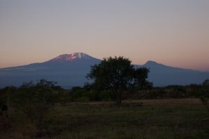 Sunset on Kilimanjaro and Mawenzi from near the JRO airport (Eric Simonson)