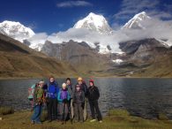 The group in front of Laguna Carhuacocha, with Siula Grande in the background. (Betsy Dain-Owens)