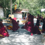 Monks debating outside the Sera Monastery (Ang Jangbu Sherpa)
