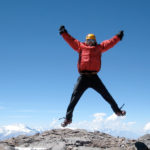 IMG climber celebrates on the summit of Aconcagua (Ben Kurdt)