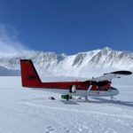 The Twin Otter at Vinson BC with Mt Vinson in the background (Justin Merle)