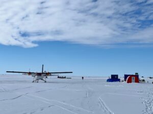 The Twin Otter on skis with the Basler BT-67 behind it (Max Bond)