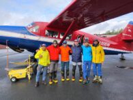 Custom Team 4 led by Timm Phillips about to board the Otter aircraft - equipped with ski landing gear - at the airport in Talkeetna.