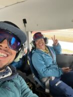 Lead Guide, Max Bond, and Assistant Guide, Lindsey Valero, sitting in the ski plane abut to take off