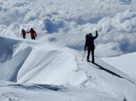 An IMG D Team arrives on the summit