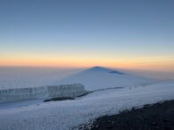 Looking west at sunrise with Kilis shadow and Meru Peak (Phunuru Sherpa)